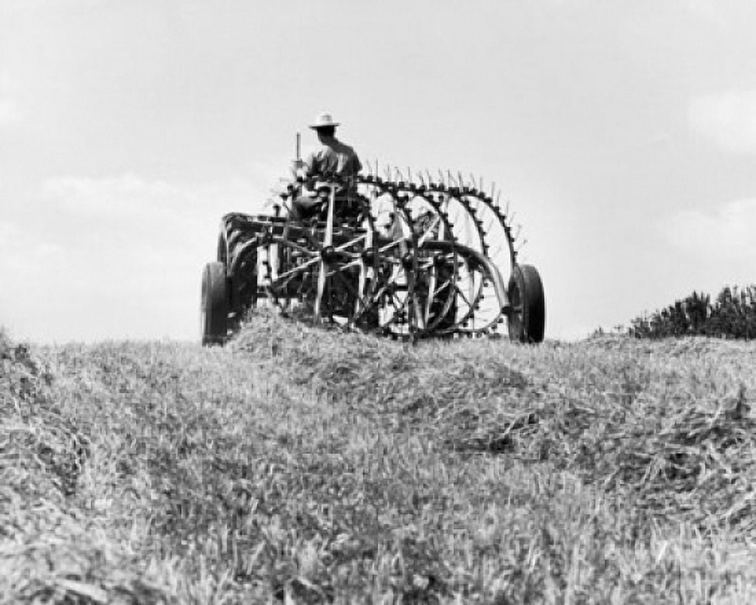Farmer sitting on a tractor in a hay field Canvas Art - (18 x 24)