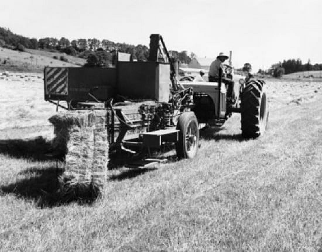 Farmer sitting on a tractor pulling hay baler in a field Canvas Art - (24 x 36)