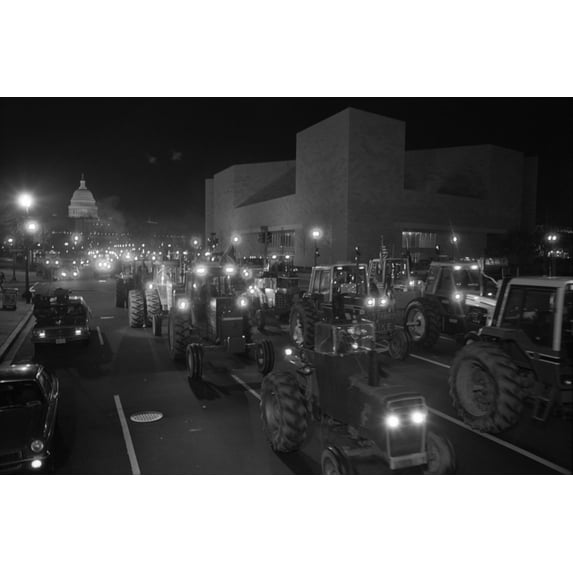 Farmers Driving Tractors Down Pennsylvania Avenue As Part Of A Night Time American Agriculture Movement Aam Protest For Higher Government Farms Subsidies. The Aam Was An Economic Protest Group Founded