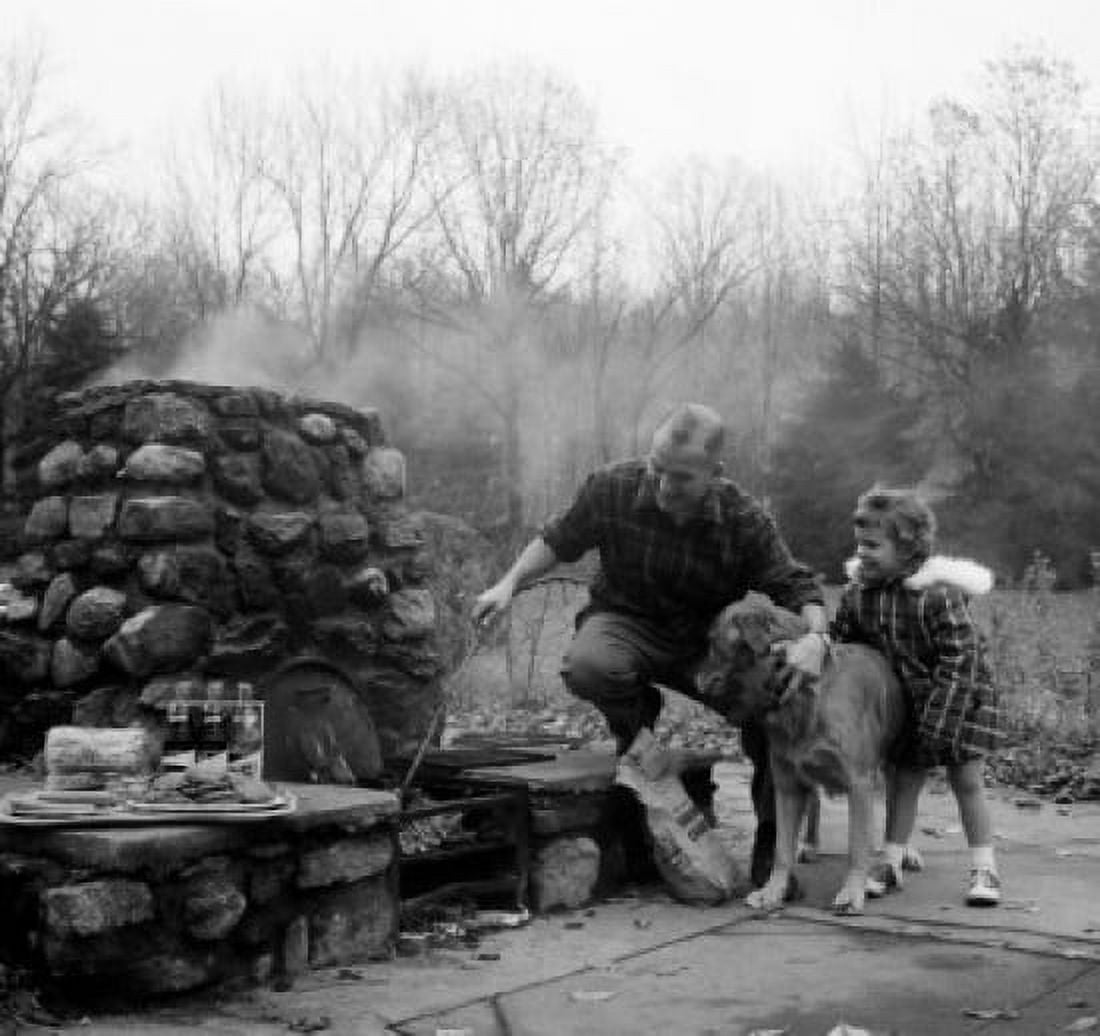 Father and his daughter preparing food on a picnic Canvas Art - (24 x 36)