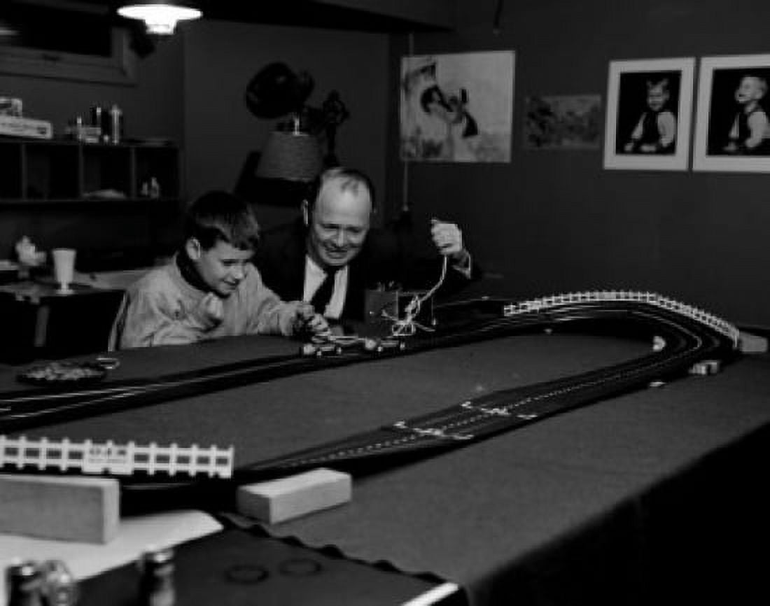 Father and son playing toy racing cars Canvas Art - (24 x 36)