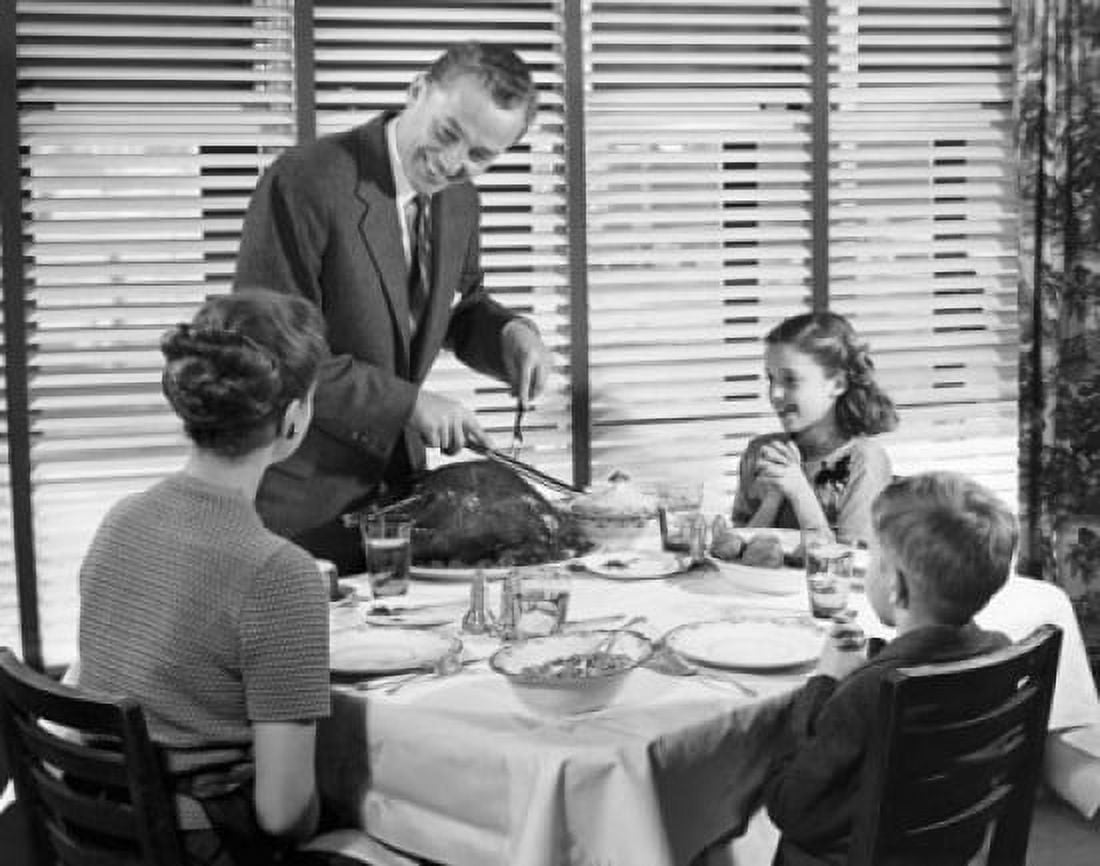 Father carving a turkey at the dinner table Canvas Art - (24 x 36)