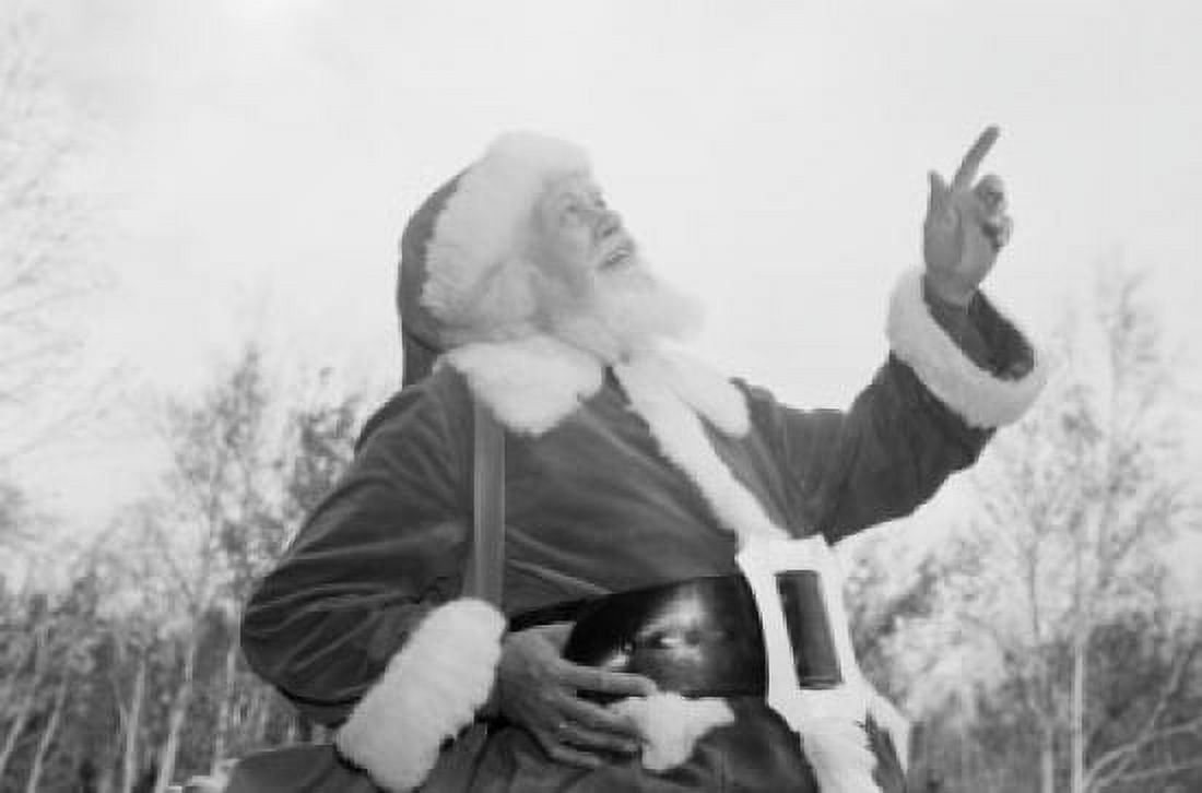 Father christmas pointing up at sky Canvas Art - (24 x 36)