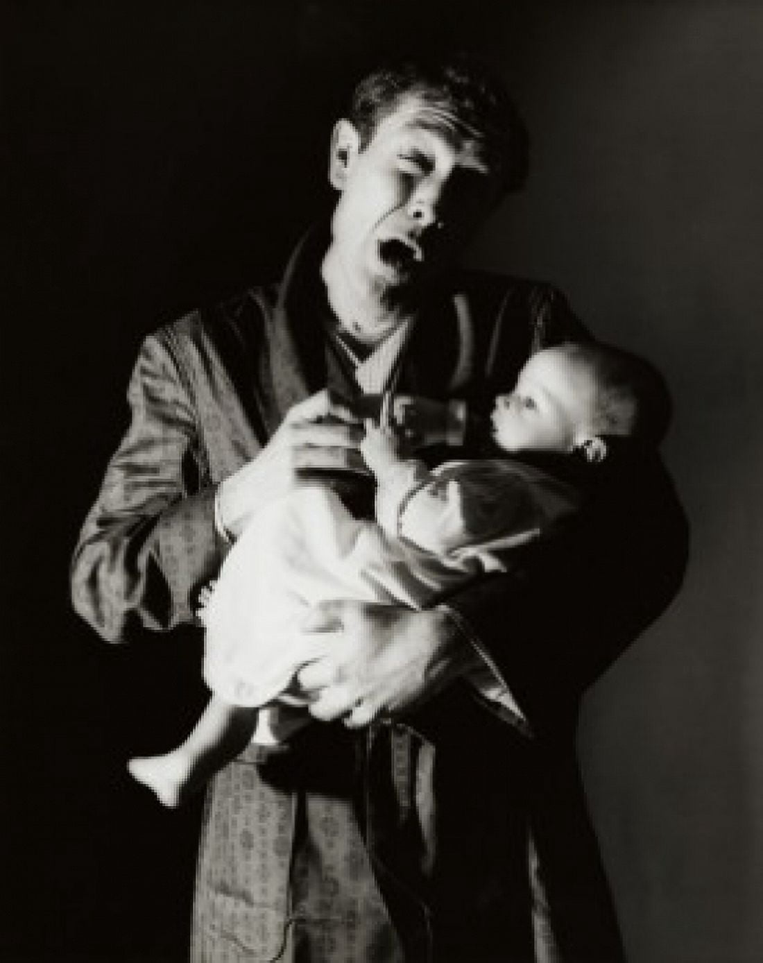 Father feeding his son with a bottle Canvas Art - (18 x 24)