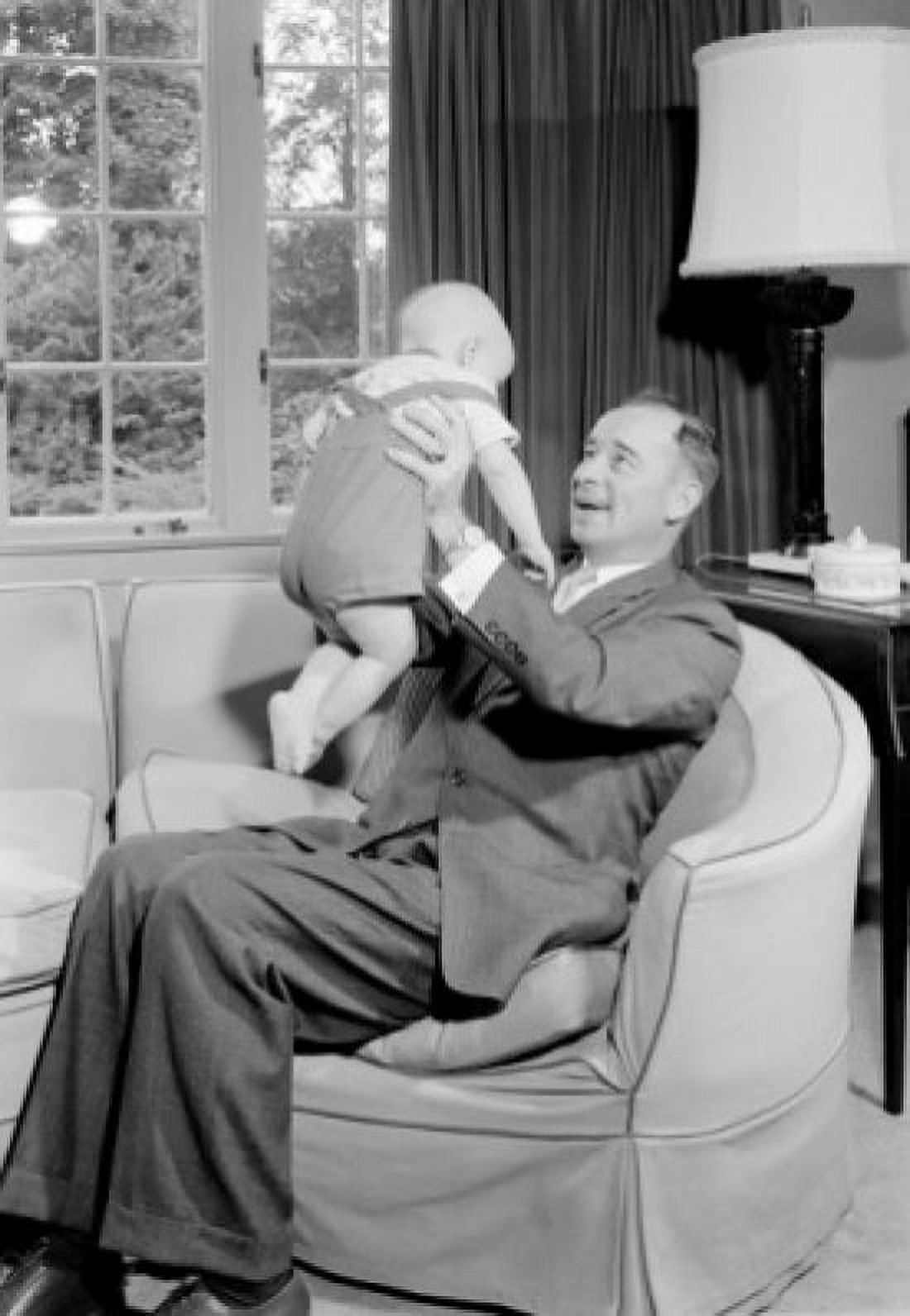 Father lifting baby boy Canvas Art - (24 x 36)