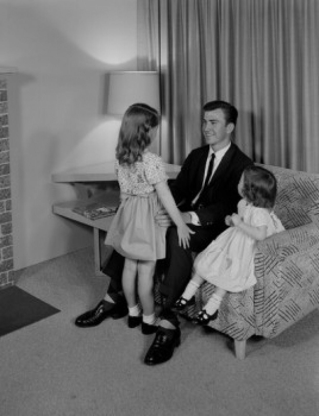 Father relaxing with daughters in living room Canvas Art - (24 x 36)