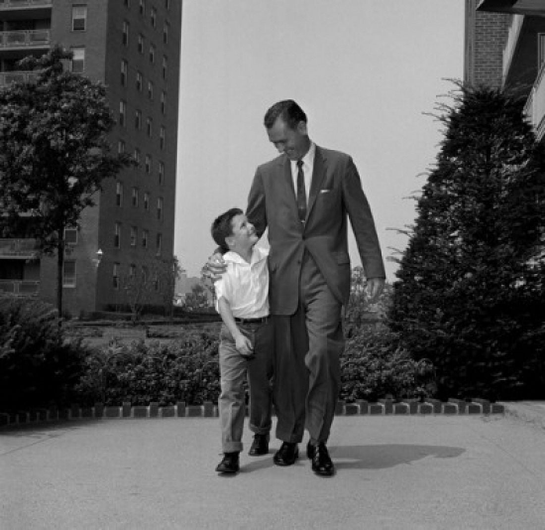 Father walking with son with arm around him Canvas Art - (18 x 24)