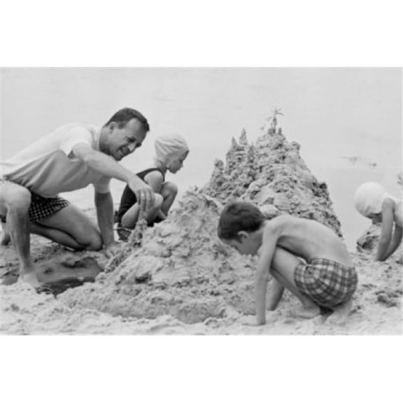 Father with Three Children Building Sand Castle on Beach Poster Print - 18 x 24 in.