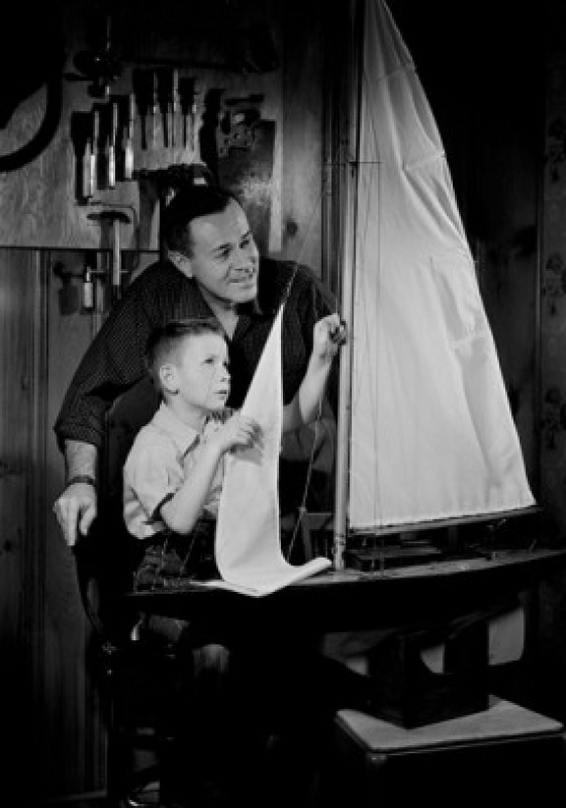 Father with son doing sailing boat model Canvas Art - (18 x 24)