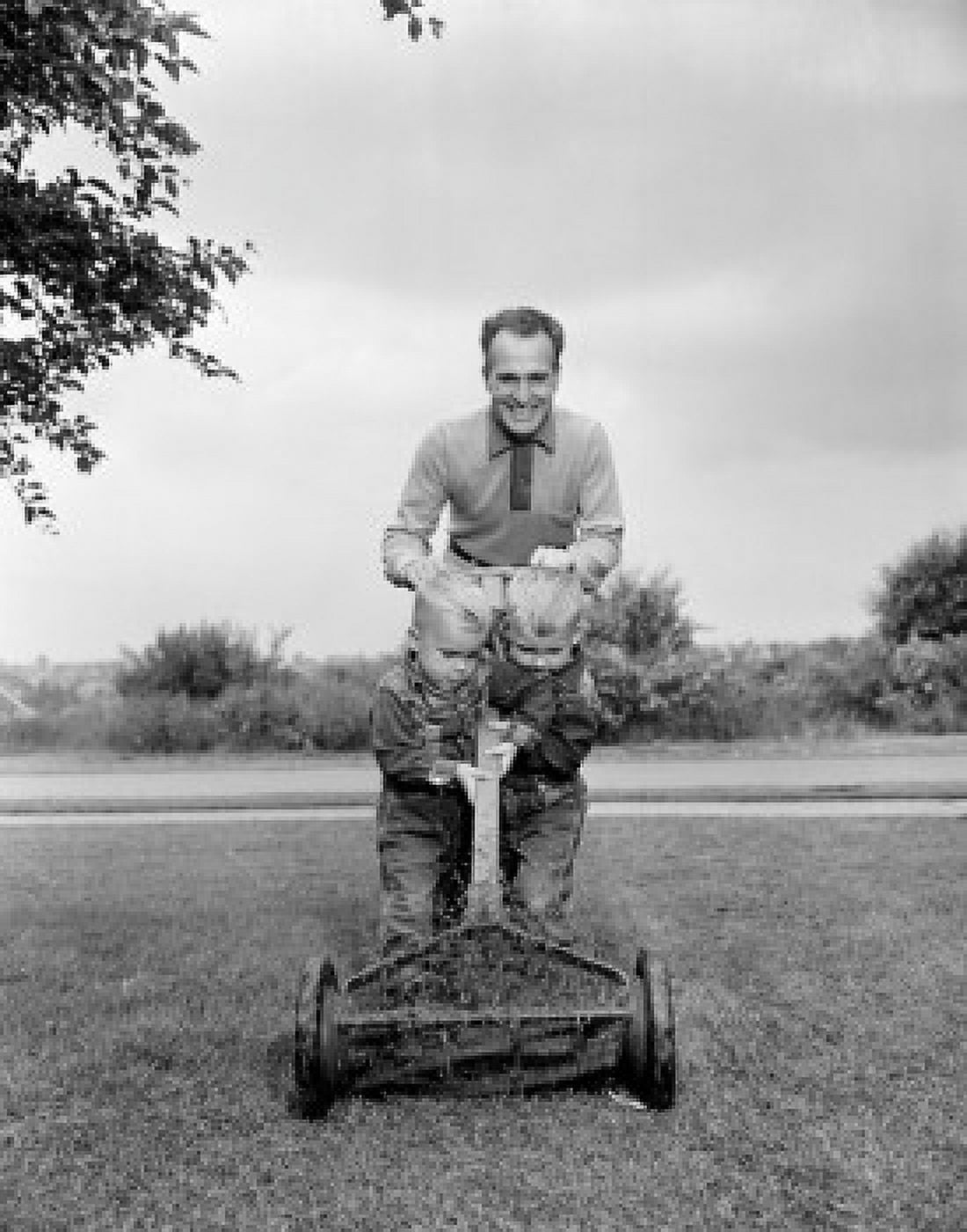 Father with two sons mowing lawn Canvas Art - (18 x 24)