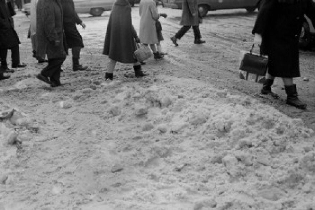 Feet of pedestrians trudging through ice and snow on city street Canvas Art - (18 x 24)