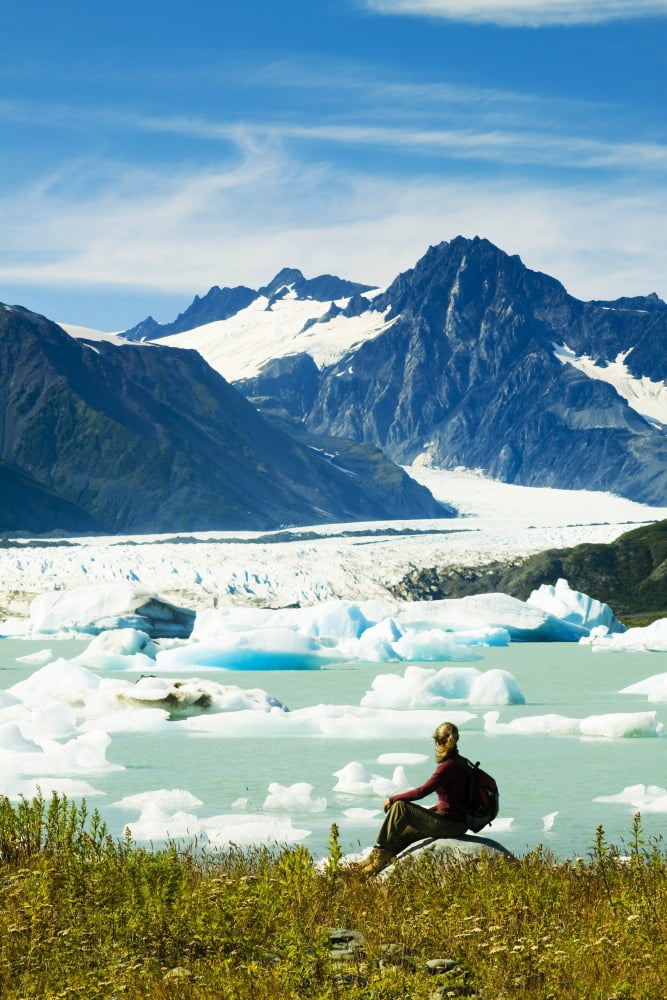 Female Hiker Pauses To View Bear Glacier From The Shore Of Bear Glacier Lake In Kenai Fjords National Park Kenai Peninsula Southcentral Alaska Summer Canvas Art - Michael DeYoung  Design Pics (22 x 34