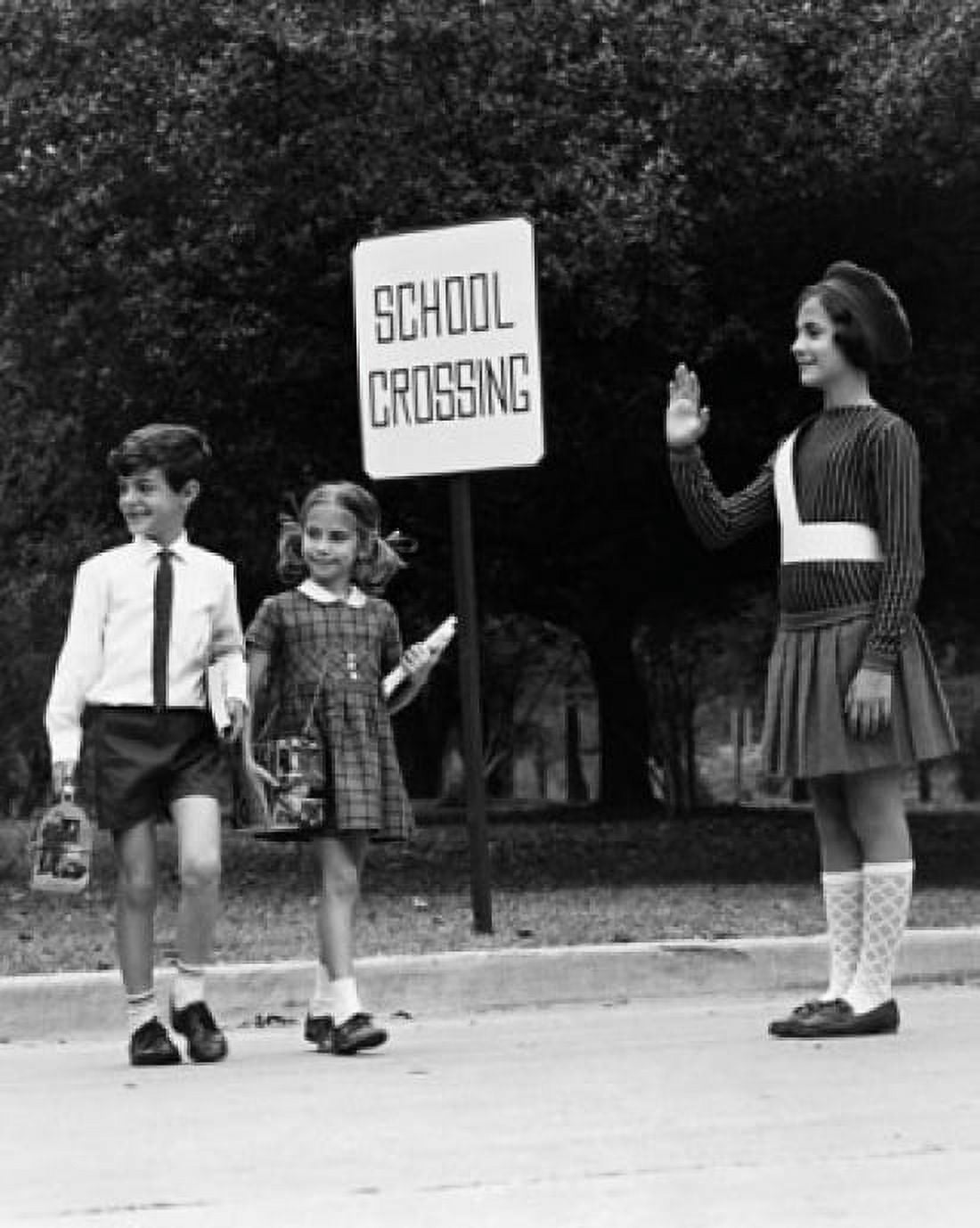 Female crossing guard assisting a boy and girl at road crossing Canvas Art - (18 x 24)