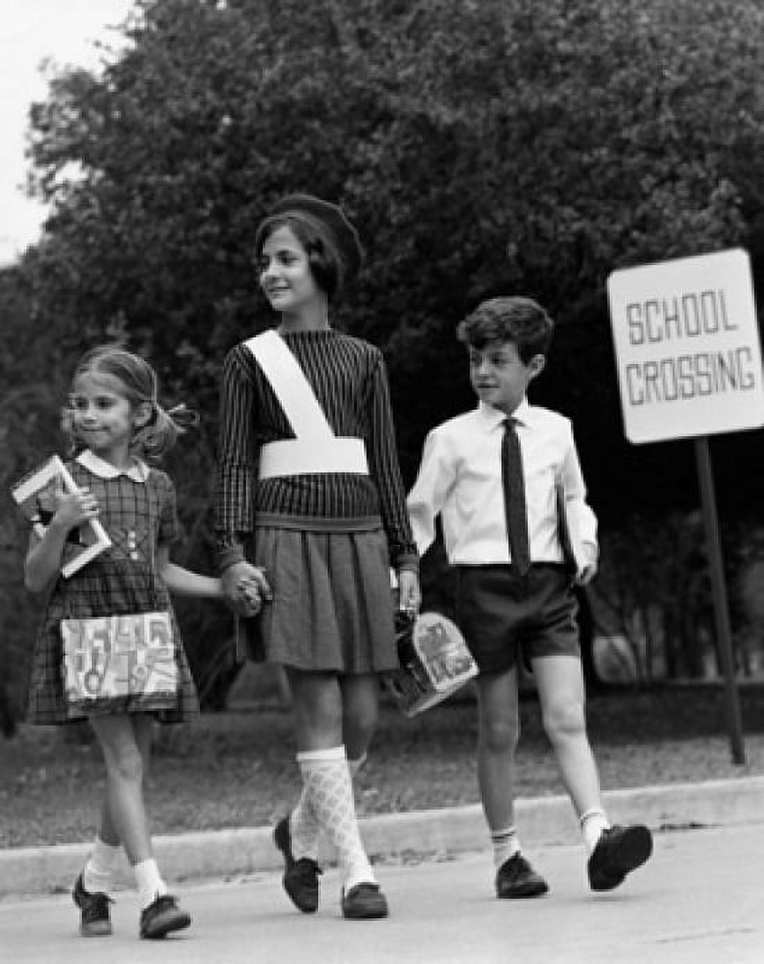 Female crossing guard assisting a boy and girl at road crossing Canvas Art - (24 x 36)