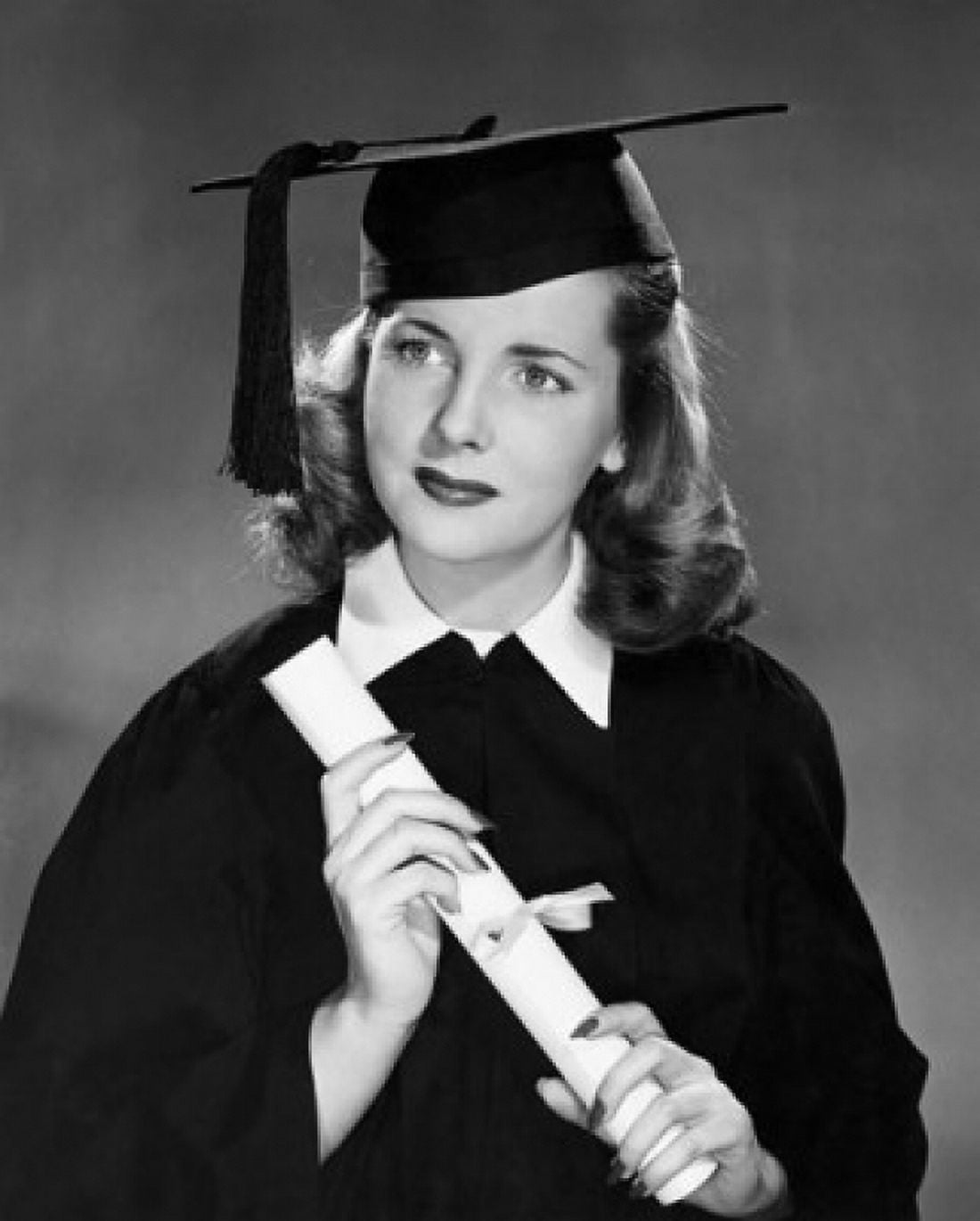 Female graduate holding diploma Canvas Art - (18 x 24)