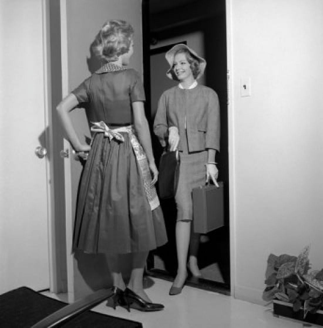 Female insurance agent entering household while housewife is standing at front door Canvas Art - (24 x 36)