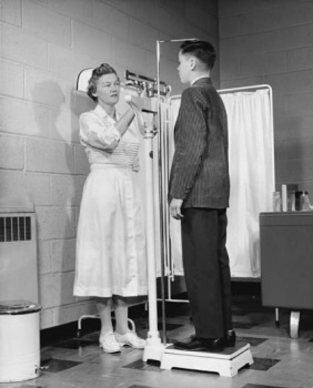 Female nurse measuring height and weight of a boy Canvas Art - (18 x 24)