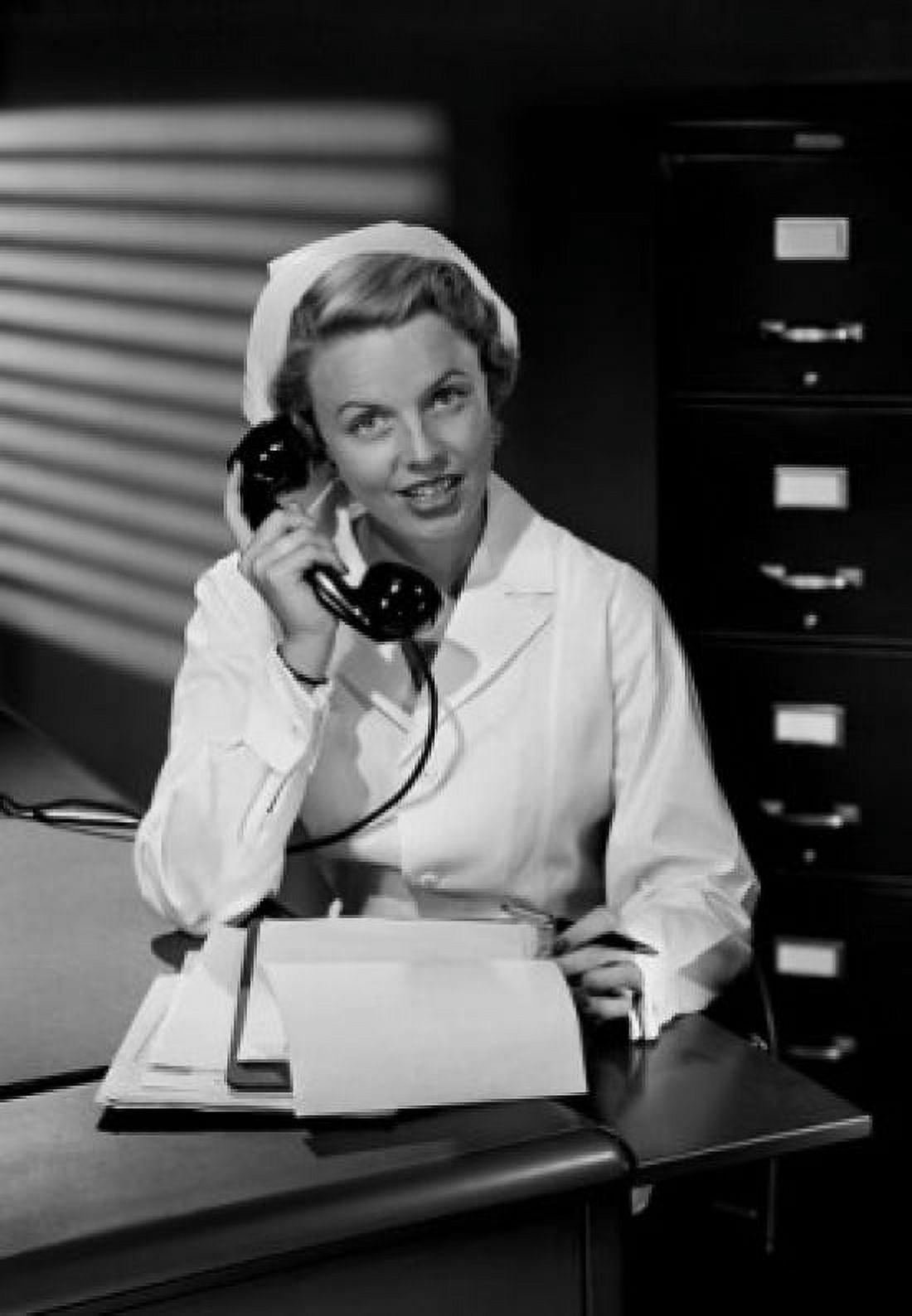 Female nurse using telephone Canvas Art - (24 x 36)