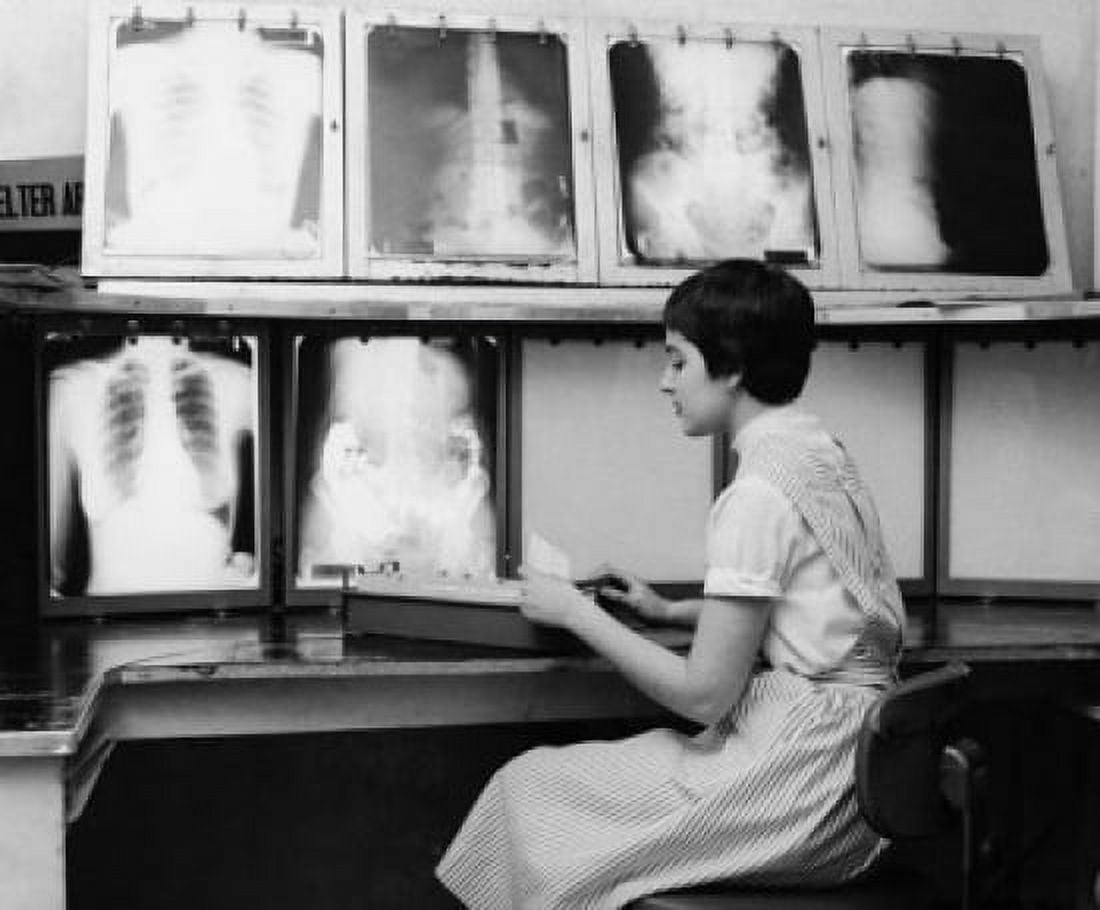 Female nurse working in a doctors office Canvas Art - (24 x 36)