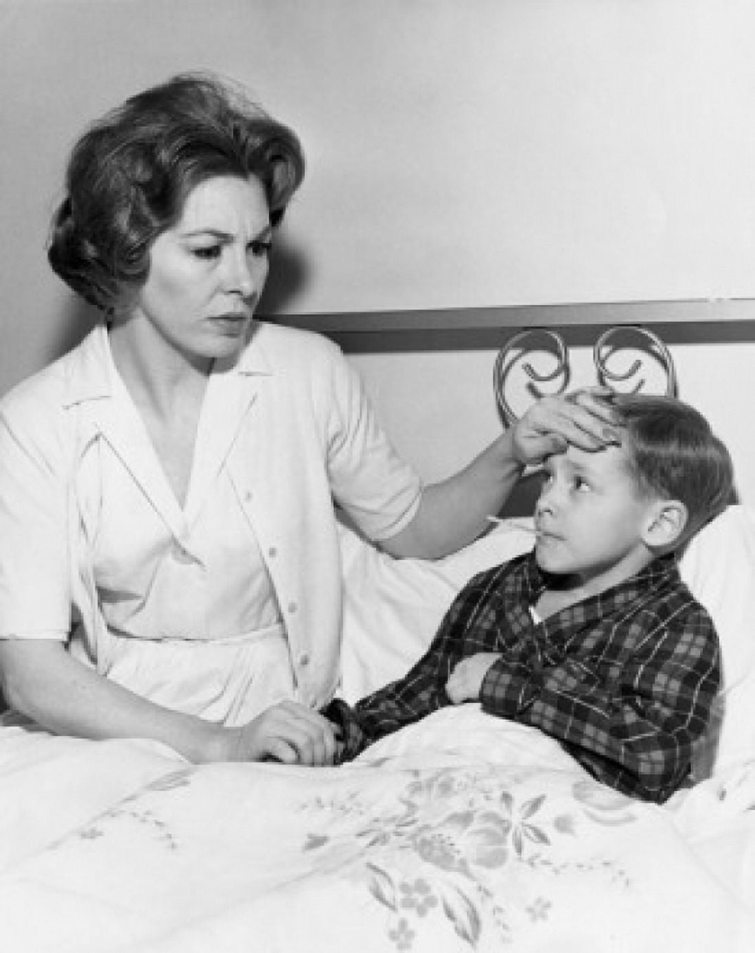Female pediatrician checking temperature of a boy Canvas Art - (24 x 36)