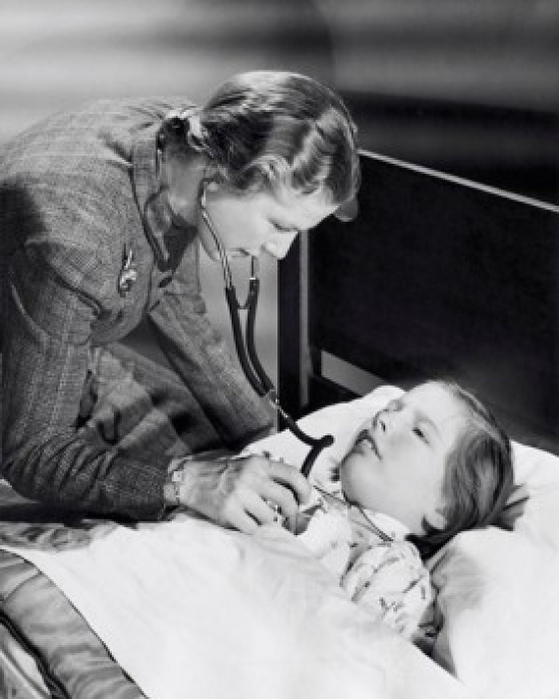 Female pediatrician examining a girl with a stethoscope Canvas Art - (18 x 24)