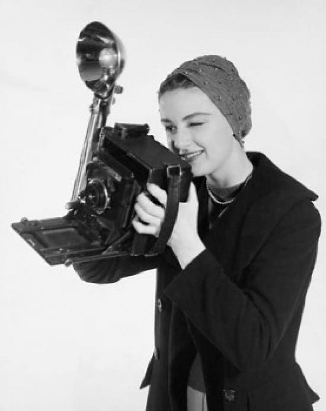 Female photographer holding a camera Canvas Art - (18 x 24)