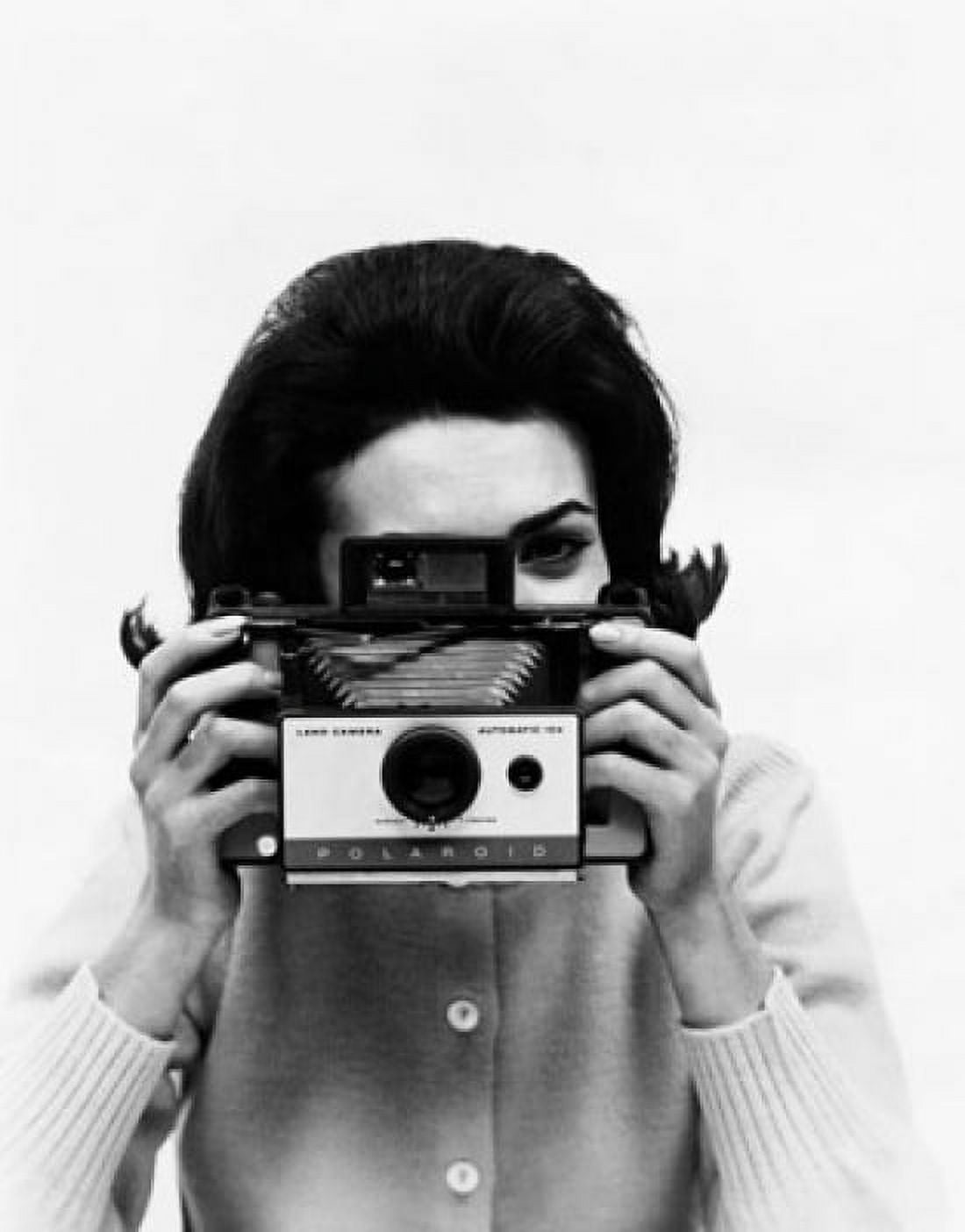 Female photographer taking a photograph Canvas Art - (18 x 24)