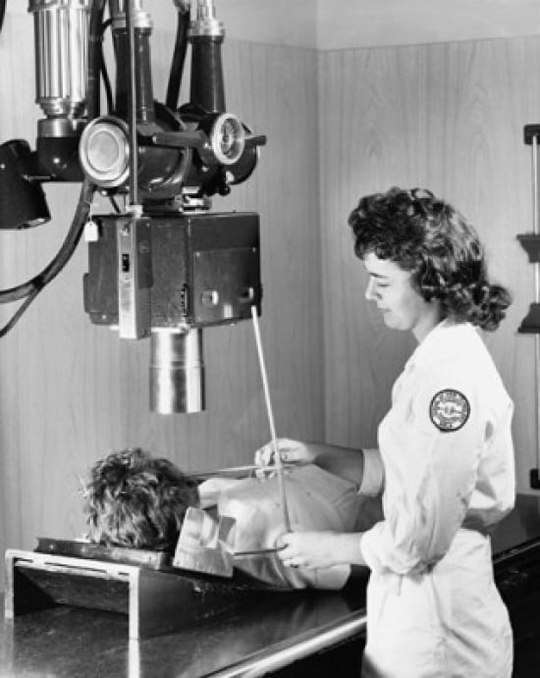 Female radiologist taking an x-ray of a patient Canvas Art - (24 x 36)