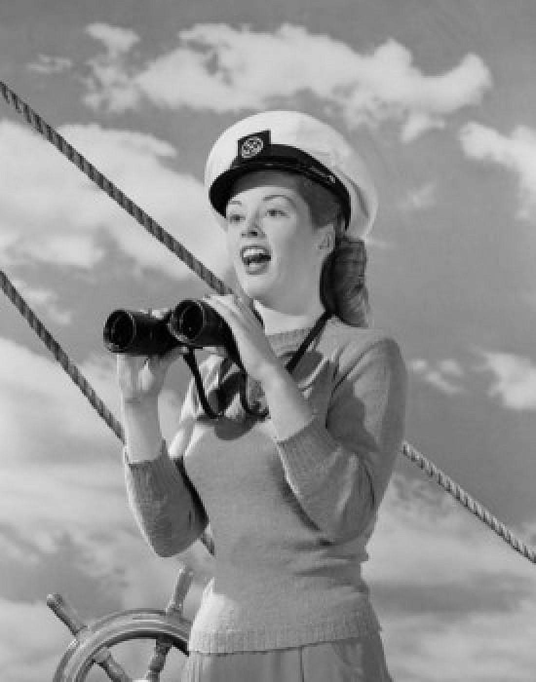 Female sailor holding binoculars at helm Canvas Art - (18 x 24)