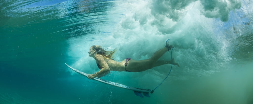 Female surfer pushes under a wave while surfing Clansthal South Africa Canvas Art - Panoramic Images (27 x 9)