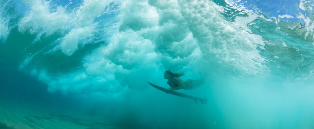 Female surfer pushes under a wave while surfing Clansthal South Africa Canvas Art - Panoramic Images (27 x 9)