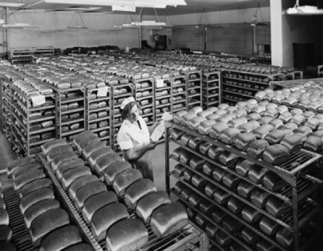 Female worker examining bread in a bakery Pepperidge Farm Bakery Norwalk Connecticut USA Canvas Art - (18 x 24)