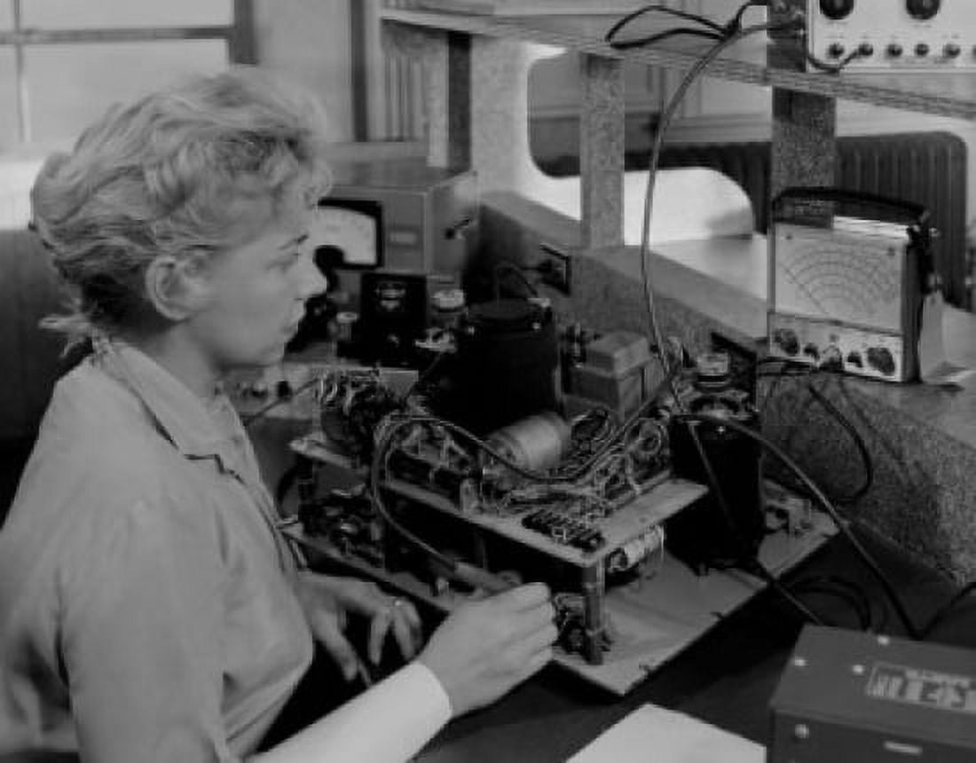 Female worker testing electronic component Canvas Art - (18 x 24)