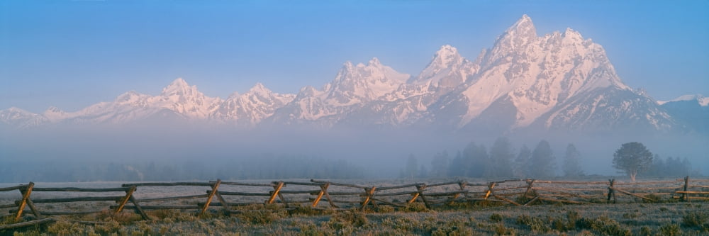Fence in a field with a mountain range in the background at sunrise Teton Range Grand Teton National Park Wyoming USA Canvas Art - Panoramic Images (12 x 36)