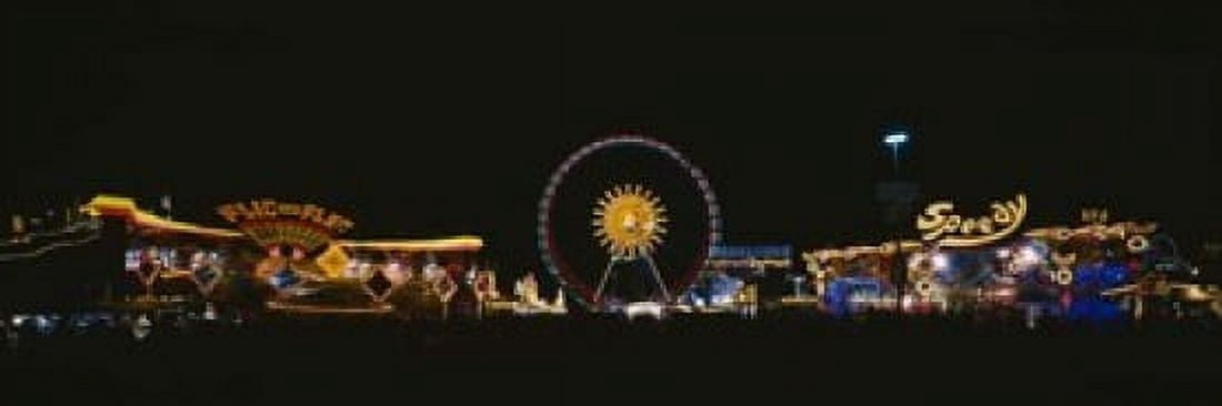 Ferris wheel and neon signs lit up at night in an amusement park Oktoberfest Munich Germany Canvas Art - Panoramic Images (18 x 6)