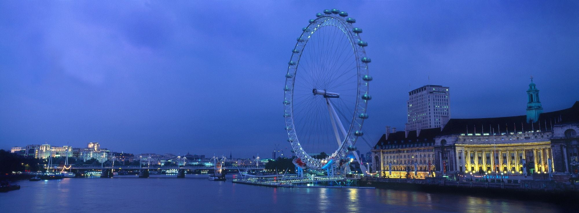 Ferris wheel at the waterfront Millennium Wheel London County Hall River Thames London England Canvas Art - Panoramic Images (27 x 9)