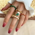 thumbnail image 1 of Festive Holiday Alloy Rings, 4-Piece Set: Snowflake, Gift Box, Elk, Bell, and Santa Claus Designs, 1 of 2