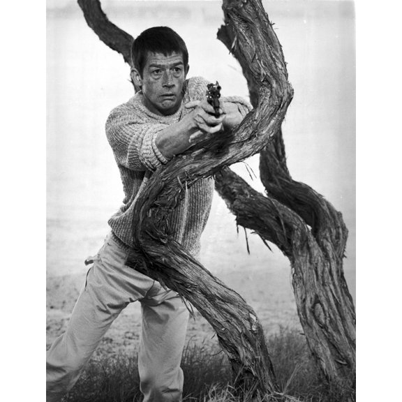 Film still featuring John Hurt with a gun Photo Print (8 x 10)