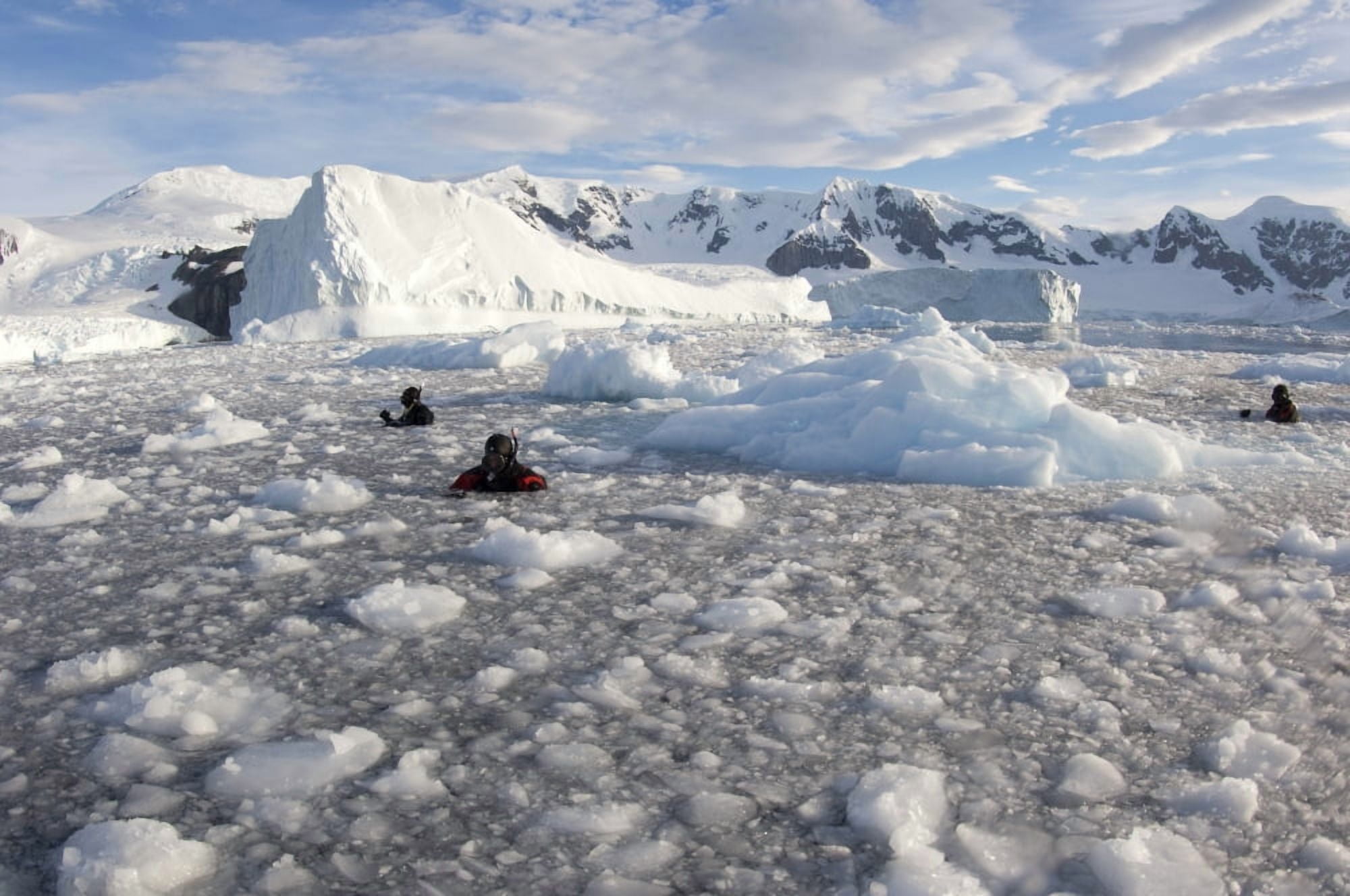 Filmmakers photographers and scientists at work in brash ice behind Danco Island Canvas Art - Steve JonesStocktrek Images (35 x 23)