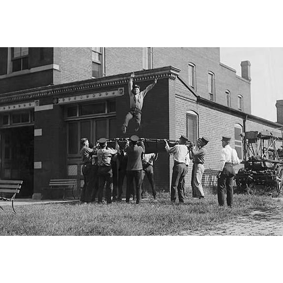 Firefighter Jumps into Net Held by Fellow Firemen-Fine art canvas print (20" x 30")