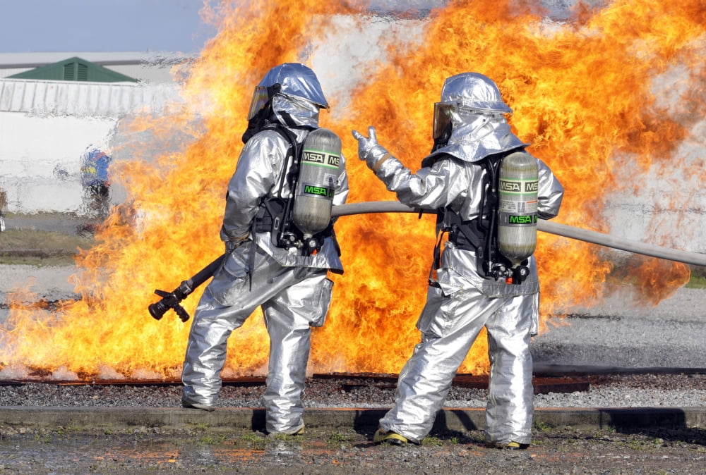 Firefighters battle a simulated fire Canvas Art - Stocktrek Images (34 x 23)