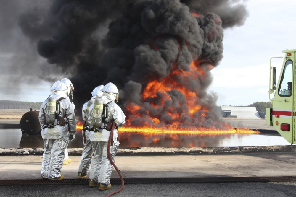 Firefighting Marines watch as a training fire builds intensity Canvas Art - Stocktrek Images (35 x 23)