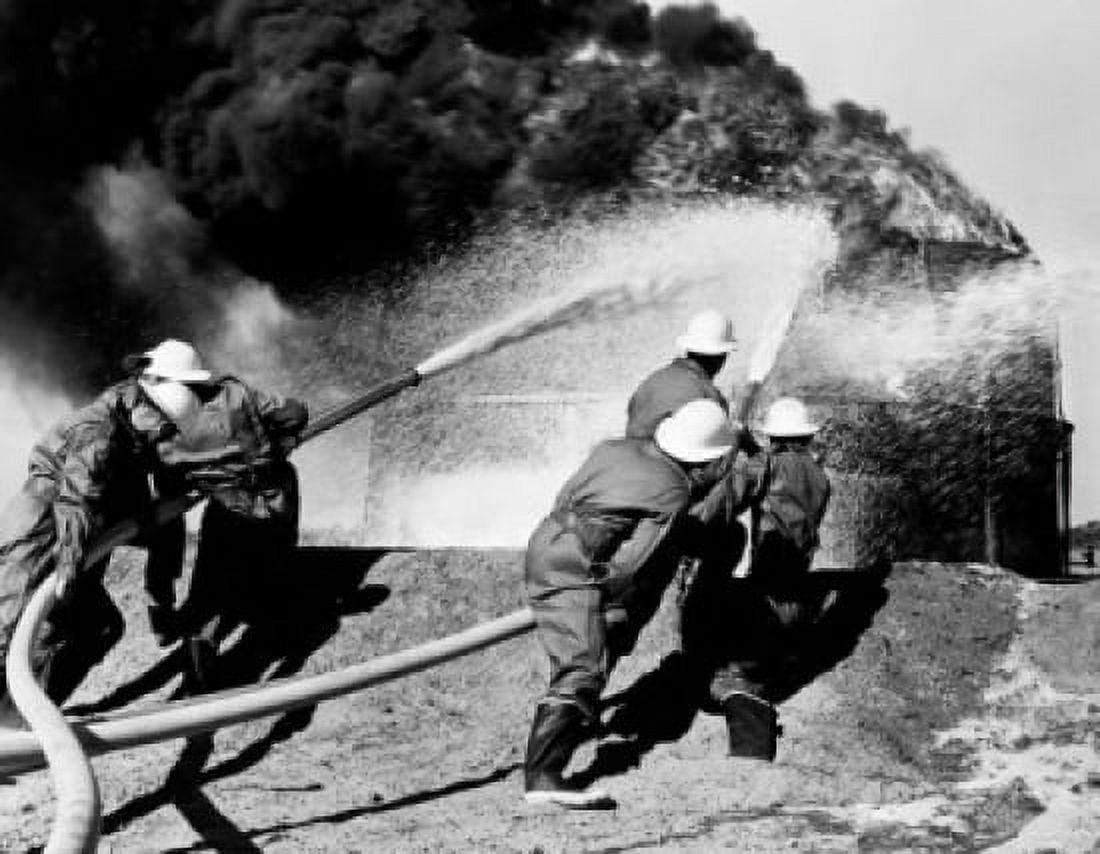 Firemen fighting oil fire Canvas Art - (24 x 36)