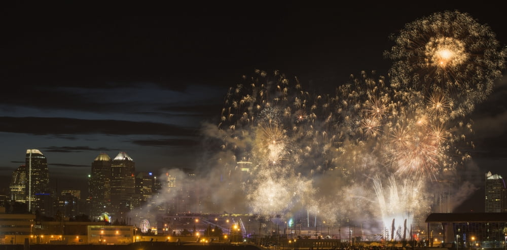 Fireworks in front of modern city skyline Calgary Alberta Canada Canvas Art - Philippe Widling Design Pics (22 x 10)