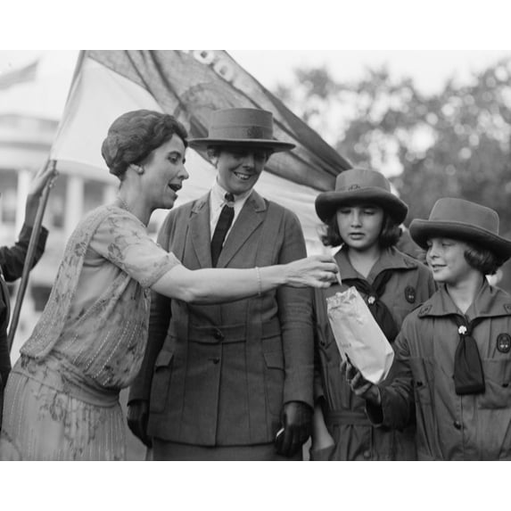 First Lady Grace Coolidge Enthusiastically Samples Girl Scout Cookies. October 17 History (36 x 24)