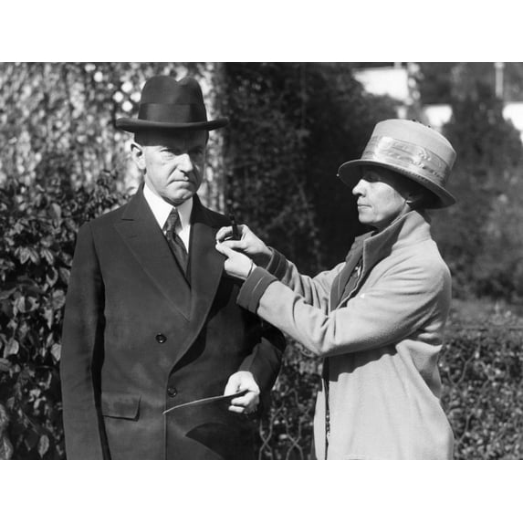 First Lady Grace Coolidge Pins A Red Cross Button On President Calvin Coolidge'S Coat History
