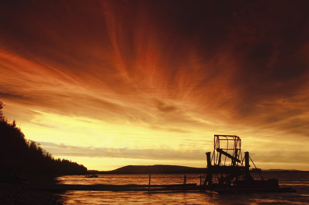 A Fish Wheel Spins During An Early Morning Sunrise On The Tanana River Near The Village Of Tanana Alaska Interior Alaska Summer Canvas Art - Chris Miller Design Pics (34 x 22)