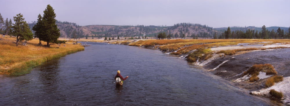 Fisherman fishing in a river Firehole River Yellowstone National Park Wyoming USA Canvas Art - Panoramic Images (27 x 9)