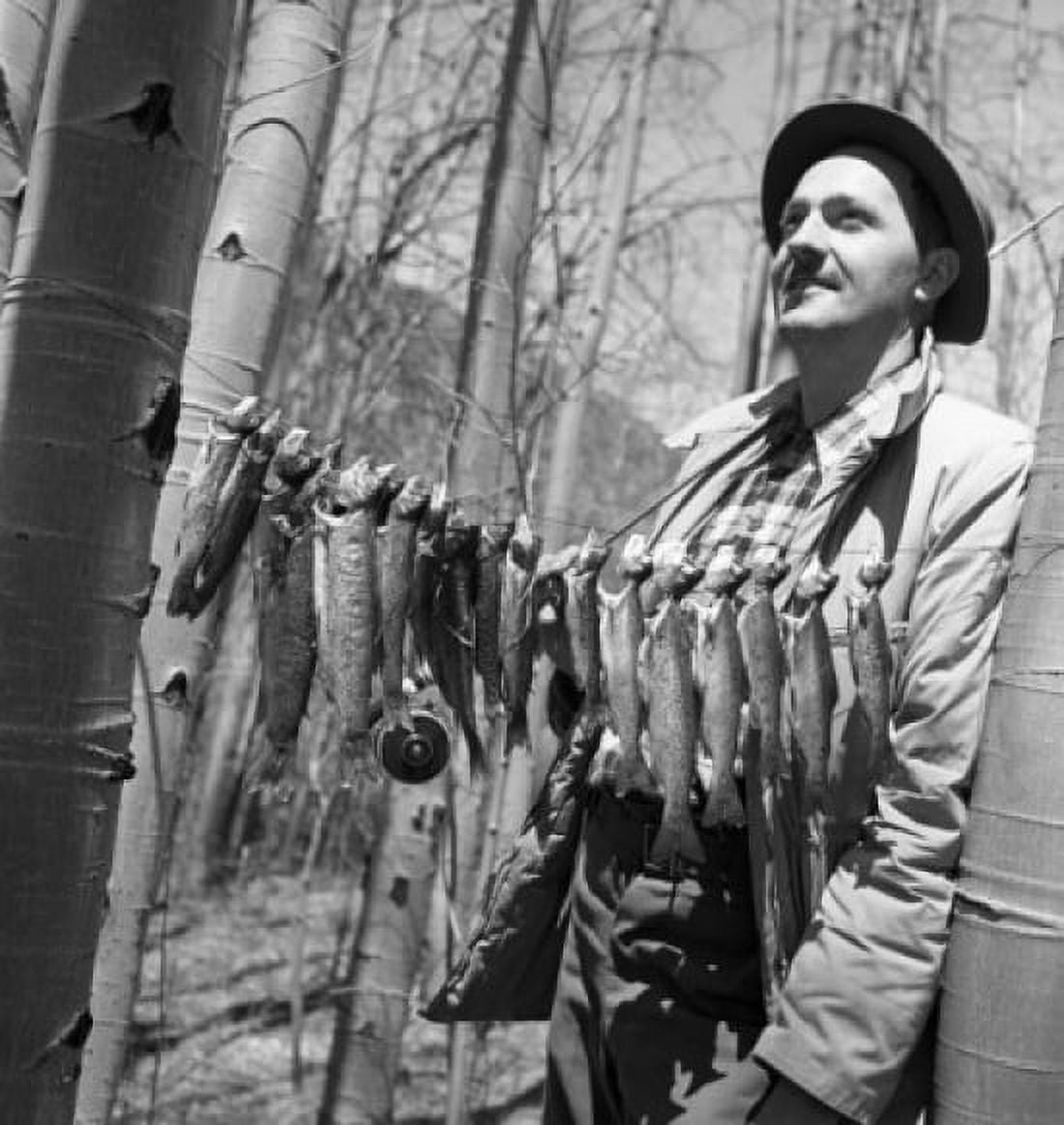 Fisherman with row of fish hanging between trees Canvas Art - (18 x 24)