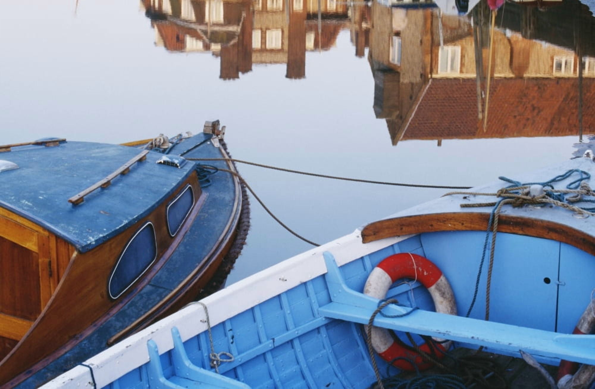 Fishing Boats And Reflection Of Houses In Harbor Blakeney Canvas Art - Chris Parker Design Pics (19 x 12)